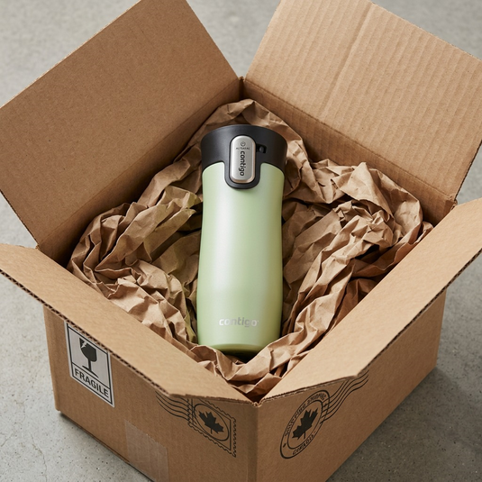 An unboxing scene shows the Contigo travel mug secure in protective crumpled paper.
