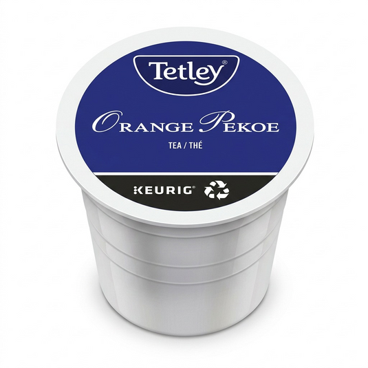 A high-resolution, centered photograph of a single Tetley Orange Pekoe K-Cup pod.