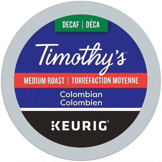 A high-resolution, pure white background studio packshot of the Timothy's Decaf Colombian K-Cup pod. The image captures the crisp details and canonical branding as a premium ecommerce hero shot, focusing on the specific product referenced.