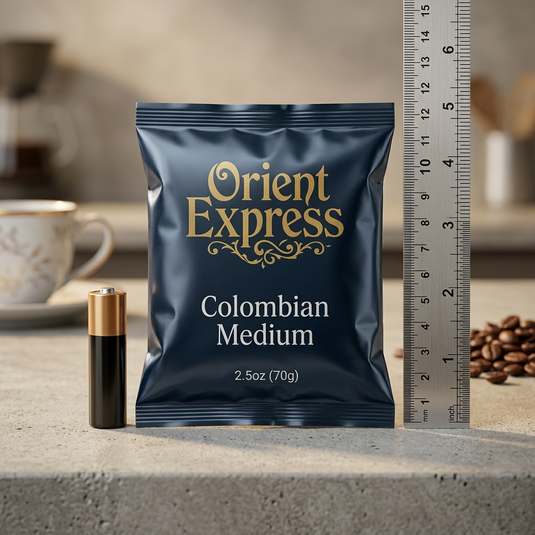 A PDP image showing the 2.5oz Orient Express coffee packet next to a standard AA battery for scale, on a clean, light surface.