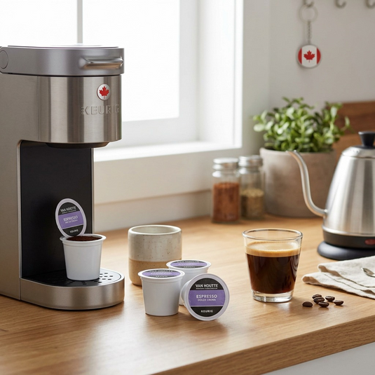 A photo of an espresso machine and cup next to Van Houtte K-Cup capsules on a wooden countertop.
