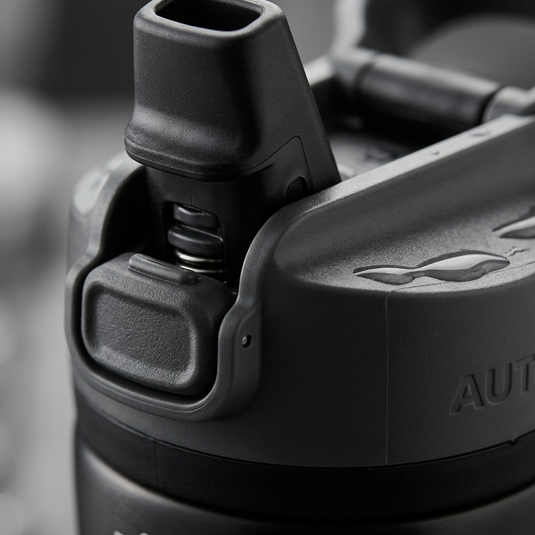 Macro photo detailing the Contigo water bottle's AUTOSEAL mechanism, button, and spout textures.